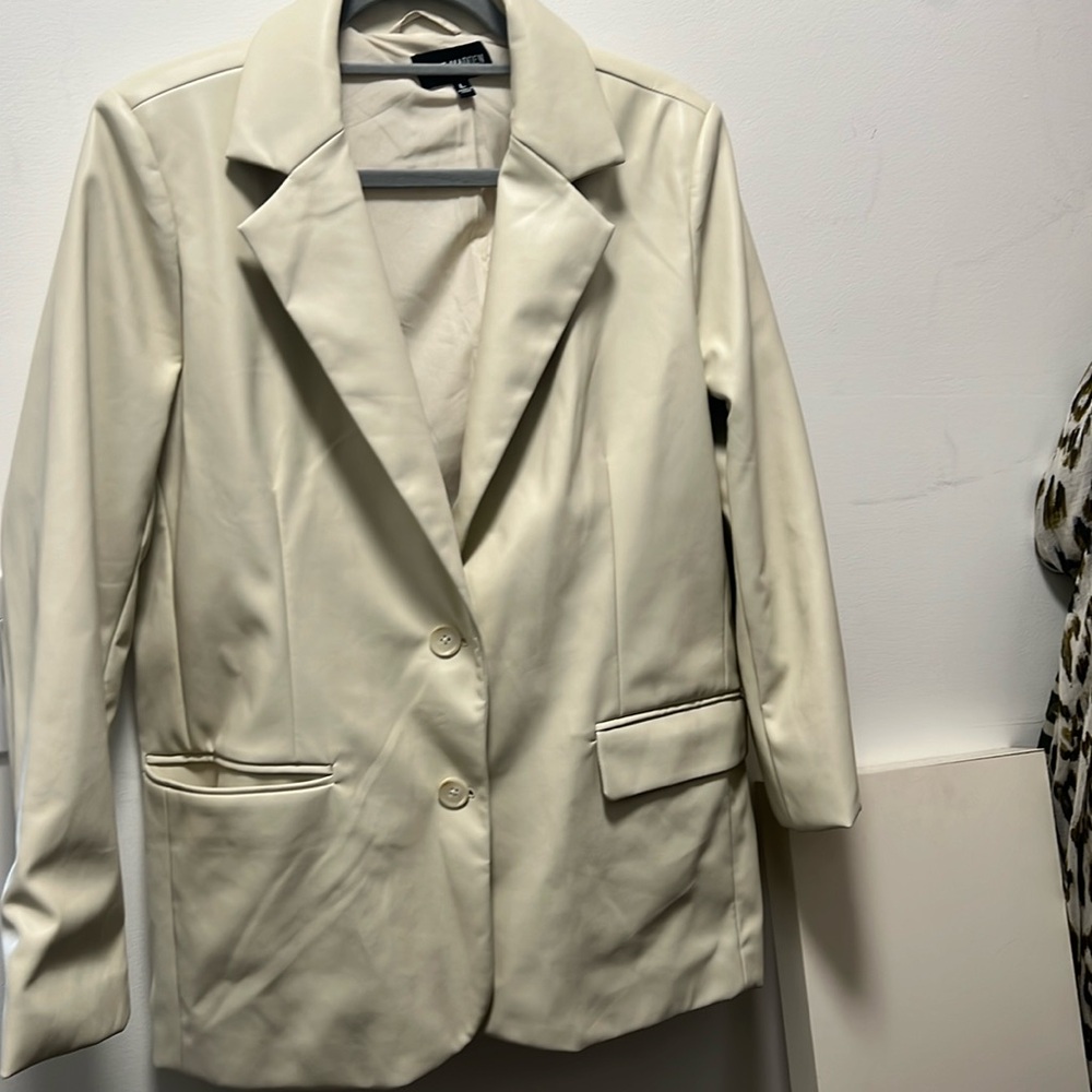 Cream leatherette blazer.